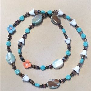 Multi media necklace with beads, gems and flowers